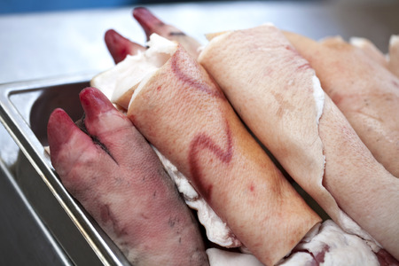 Pork feet and meat fat in a deli shopの写真素材