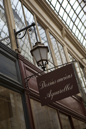 Vintage wooden panel front of a Parisian watercolors shopのeditorial素材
