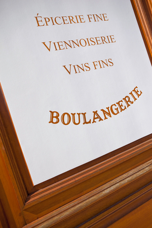Signs on a wooden panel of a French bakeryの写真素材