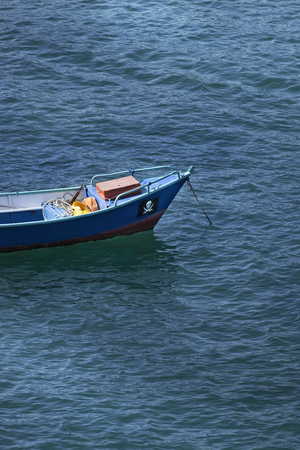 Small fishing boat on the blue seaの写真素材