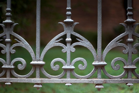 Vintage wrought iron fence around a park in France