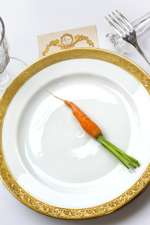 Carrot on a porcelain plateの写真素材