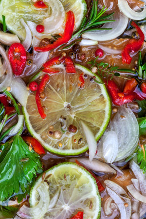 Vegetal and pepper ingredients for a marinade in a bowl 