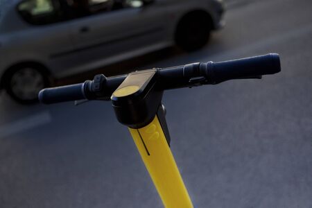 Close up of an electric scooter in a city streetの写真素材