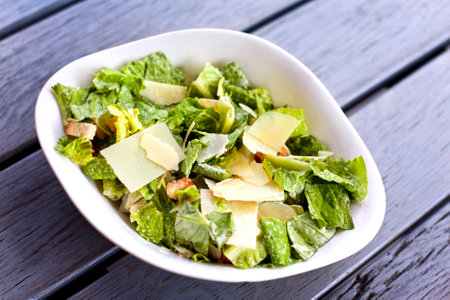 Lettuces leaves with parmesan and toastの写真素材