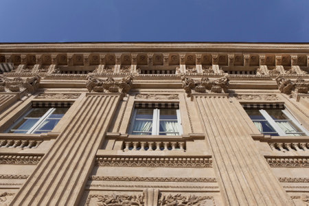 Facade of a classical French stoned building in Parisのeditorial素材