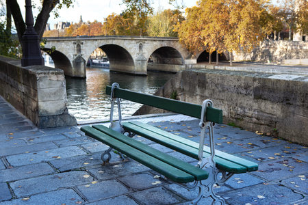 Public bench on the banks of the Seine in Parisの写真素材