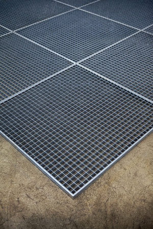 Metal grate on concrete floor
