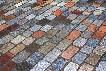 Background of granite paving stones in a street in Bordeaux