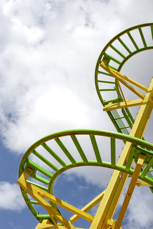 Part of a roller coaster and cloudy blue sky on backgroundの写真素材