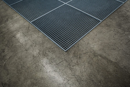 Metal grid on a concrete floor