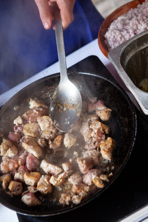 Cooking pork in a panの写真素材