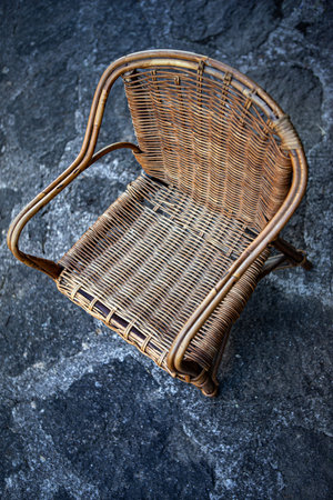 Old wicker armchair on the ground