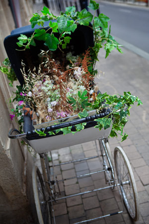 Plastic flowers in a pram