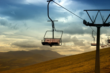 Rows of ski chair lifts