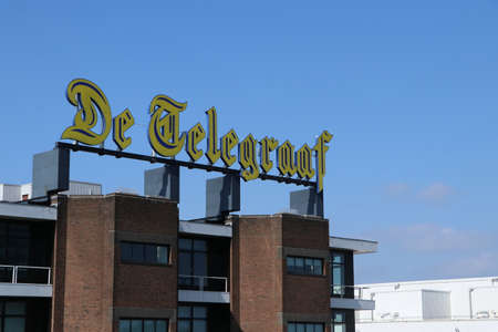 logo of newspaper DE TELEGRAAF on top of building head office of Dutch Telegraaf Media Groep, TMG in Amsterdam, the Netherlands, September 3 2021のeditorial素材