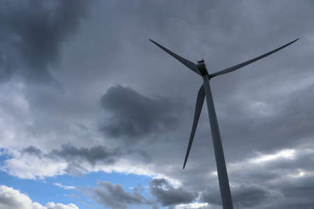 Wind turbine in cloudy sky, closeup. Alternative renewable energy sourceの写真素材