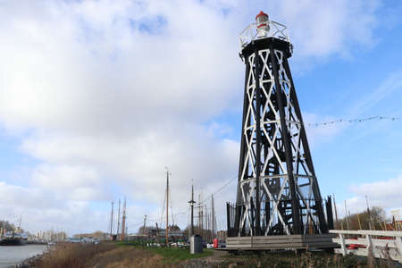 lighthouse at harbor dutch town Enkhuizen, the Netherlandsの写真素材