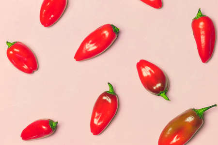 Red Sweet Peppers on Pink Backgroundの写真素材