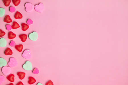 Pink and Red Candy Valentine's Day Conversation Hearts on Pastel Backgroundの写真素材