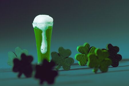 Green Pint of Ale with Green Wood Shamrock Cloversの写真素材