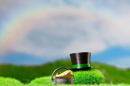 Outdoors Leprechaun Hat in Meadow under a Rainbowの写真素材