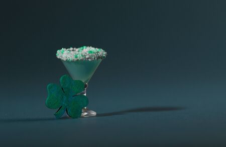 St. Patrick's Green, Sugar Rimmed, Confetti Cocktail with Wooden Shamrockの写真素材