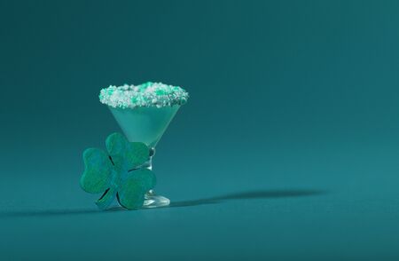 St. Patrick's Green, Sugar Rimmed, Confetti Cocktail with Wooden Shamrockの写真素材