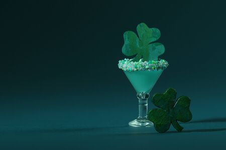 St. Patrick's Green, Sugar Rimmed, Confetti Cocktail with Wooden Shamrocksの写真素材