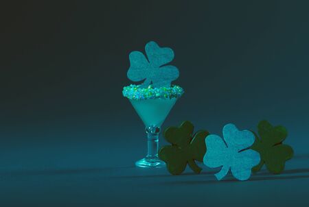 St. Patrick's Green, Sugar Rimmed, Confetti Cocktail with Four Wooden Shamrocksの写真素材