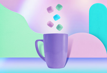 Playful and Vibrant Blue Mug with Pastel Sweets - Eye-Catching Image for Bakery Ads or Holiday Campaignの写真素材