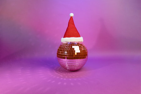 Jingle Bell Rock: A Disco Ball Adorned with Santas Hat in Festive Spirit, Nightclub Concept, Christmas Rave Partyの写真素材