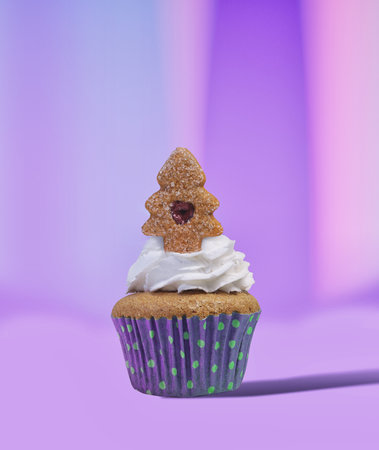 Gingerbread Christmas Tree Topping a Whipped Cream Cupcake  Ideal for Holiday Baking Blogs and Recipe Guidesの写真素材