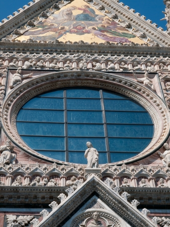 The detail from facade of the Cathedral in Sienaの写真素材