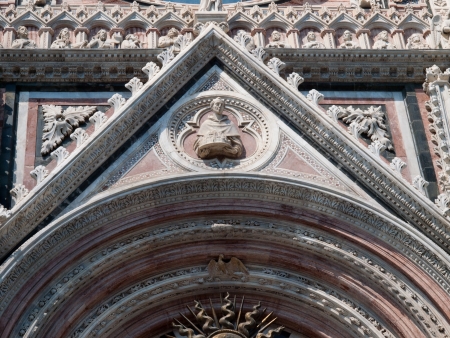 The detail of  facade of the Cathedral in Sienaの写真素材