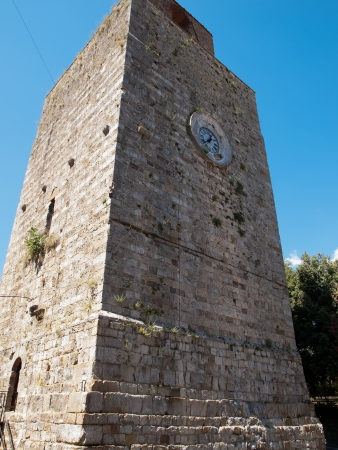 The Candeliere tower/ XII century /part of Senese fortress in Massa Marittima,Italyの写真素材