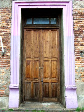 old door on brick houseの写真素材