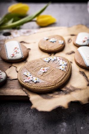 Easter cookies and spring decorations on a wooden backgroundの写真素材