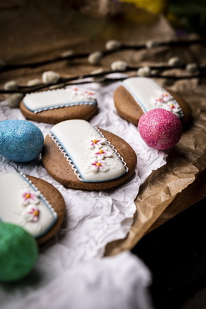 Easter cookies and Christmas decorations on a wooden backgroundの写真素材