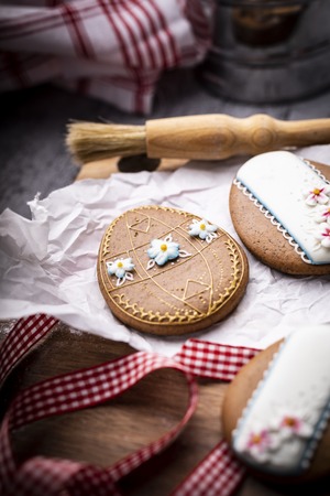 Easter cookies and spring decorations on a wooden backgroundの写真素材