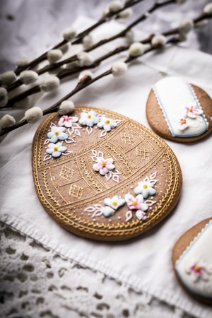 Easter cookies and spring decorations on a wooden backgroundの写真素材