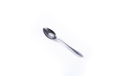 Kitchen equipment, tea spoon on a white background.の写真素材