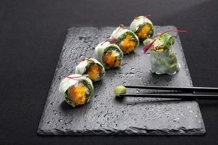 Set of sushi on a black stoneの写真素材
