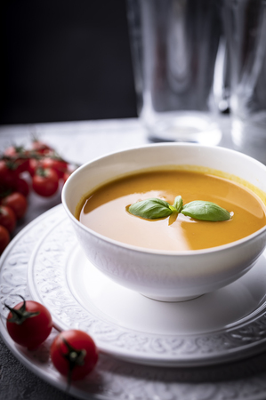 Bowl of warming pumpkin soup, a tasty nutritious mealの写真素材