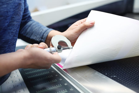 Printer at work. The printer measures the weight of the paper.