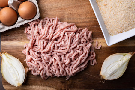 Fresh, raw minced meat from pork on the kitchen table.