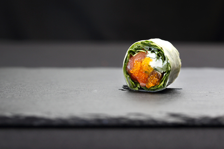 Set of sushi on a black stoneの写真素材