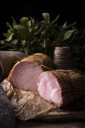 Home-made appetizing meat in a composition with herbs on an ecological rural natural background.の写真素材