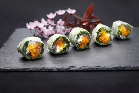 Set of sushi on a black stoneの写真素材