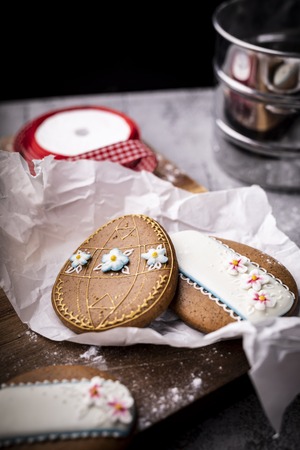 Easter cookies and spring decorations on a wooden backgroundの写真素材